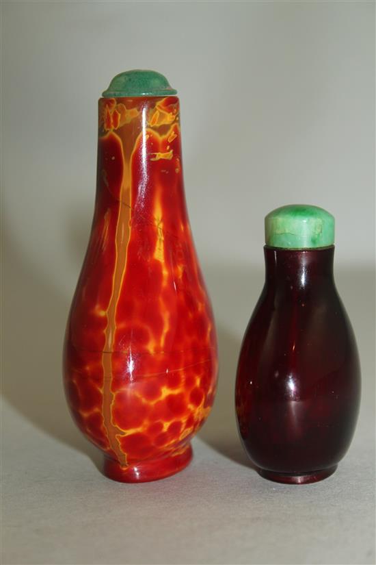 Two Chinese glass snuff bottles, 18th / 19th century, 4.1cm, the latter with jadeite stopper